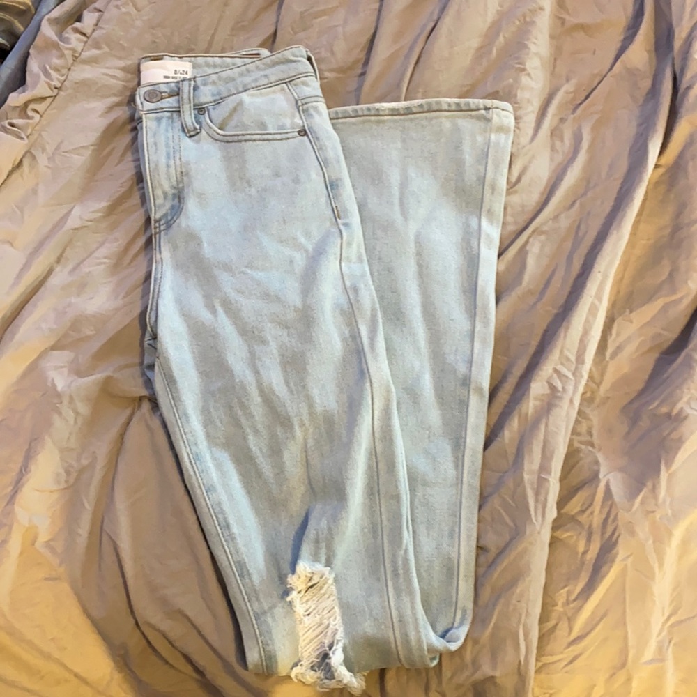 slightly ripped flare jeans
